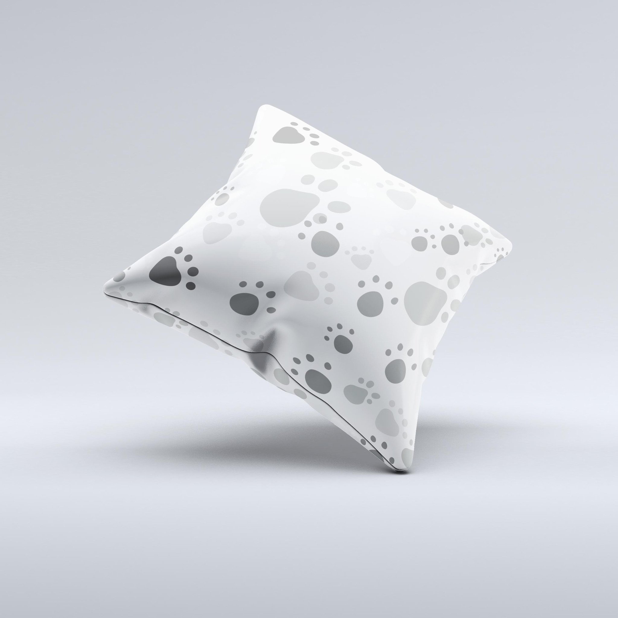 Gray and white decorative throw pillow featuring large paw prints, handcrafted in Virginia with high-quality materials.