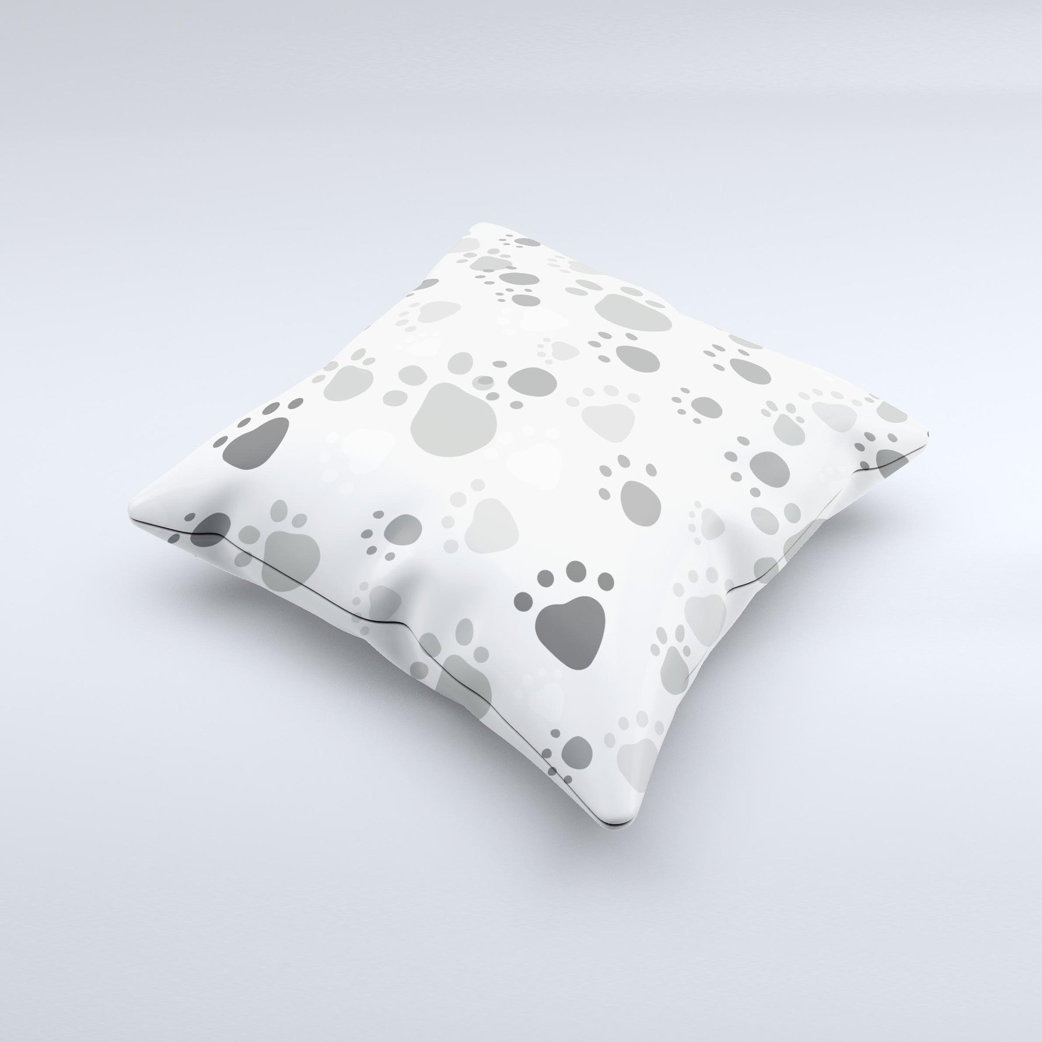 Gray and white decorative throw pillow featuring large paw prints, handcrafted in Virginia with high-quality materials.