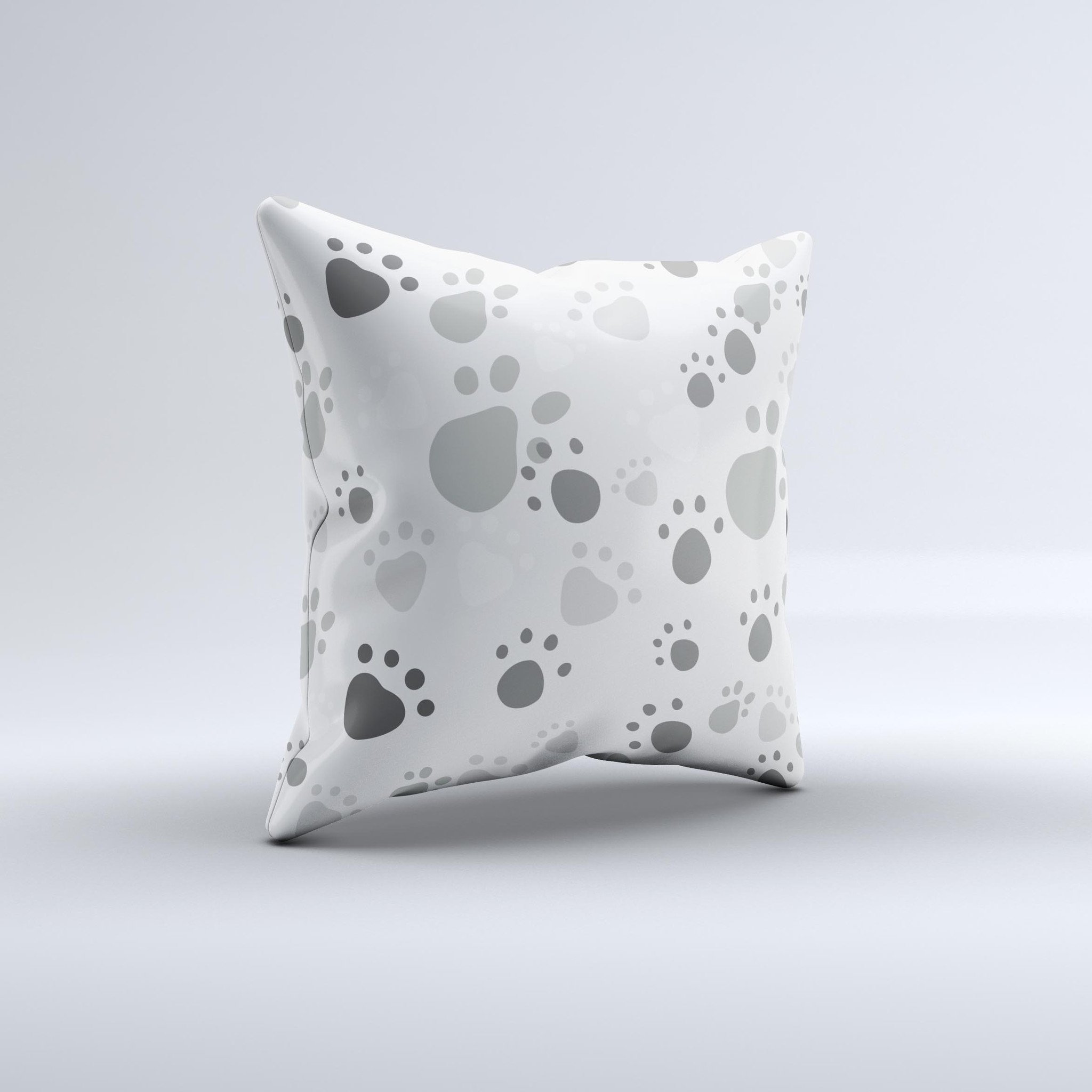 Gray and white decorative throw pillow featuring large paw prints, handcrafted in Virginia with high-quality materials.