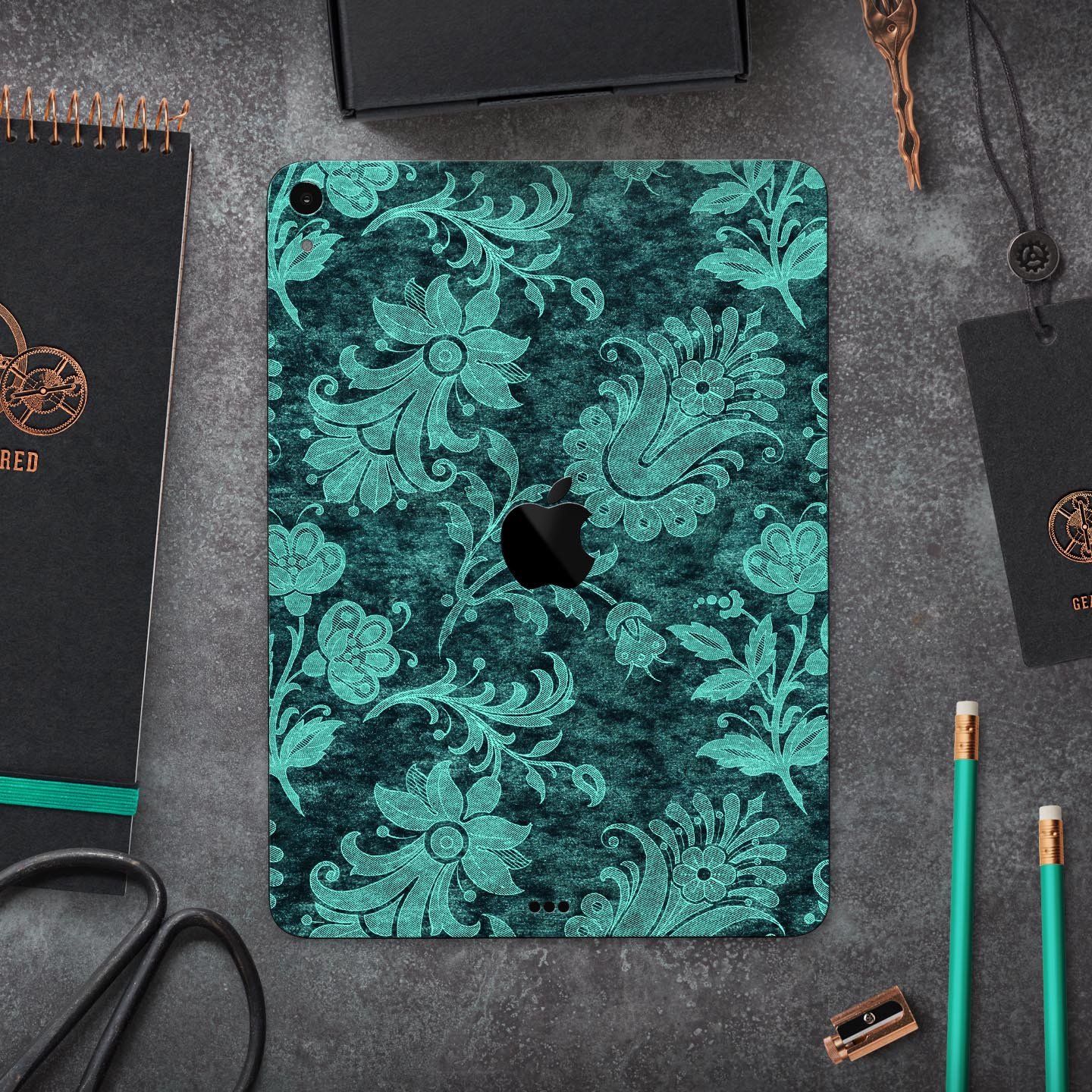 Green and Teal Floral Velvet v3 skin decal for Apple devices, showcasing a vibrant floral design on a sleek surface.