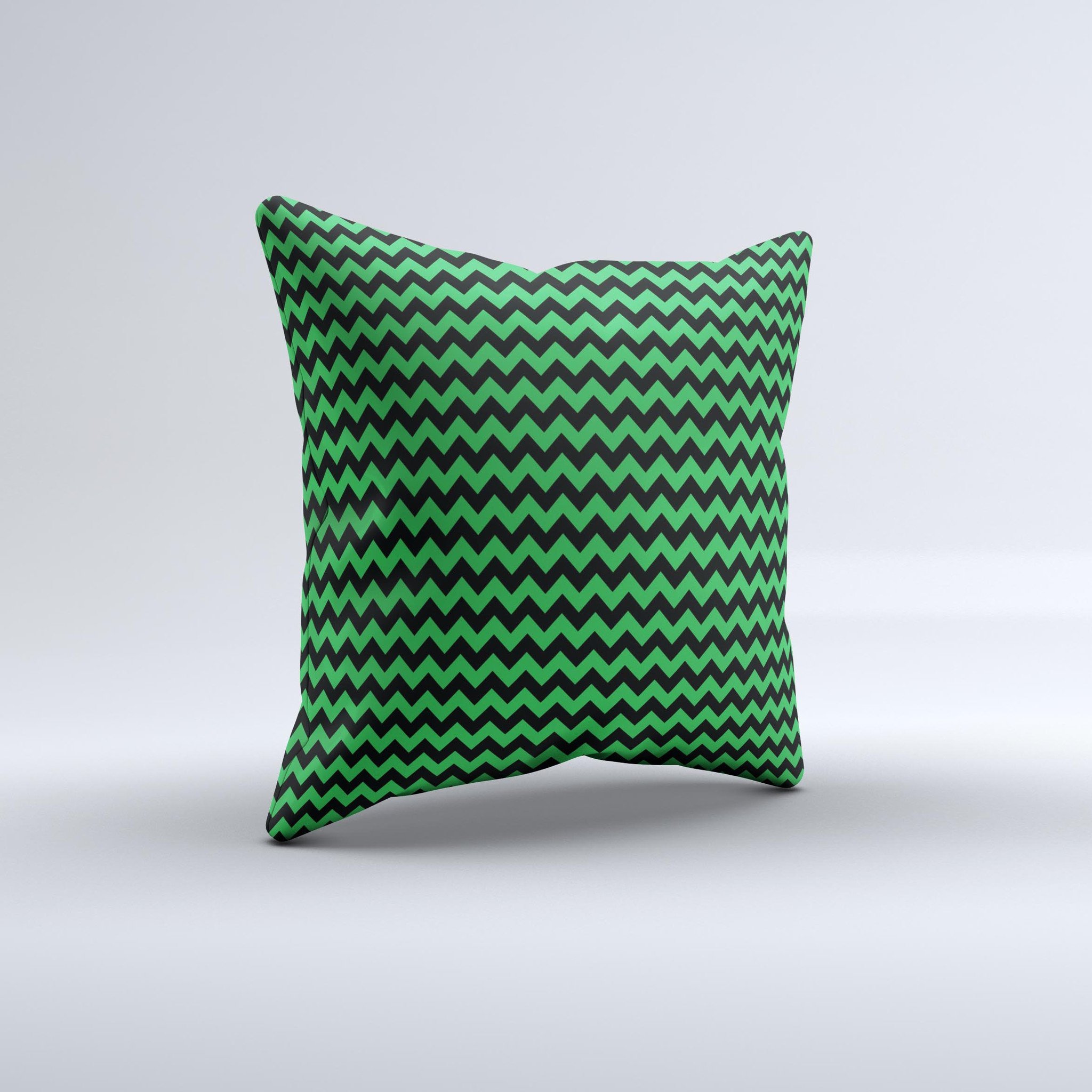 Green and black chevron pattern decorative throw pillow, handcrafted in Virginia with high thread count fabric and polyester filling.