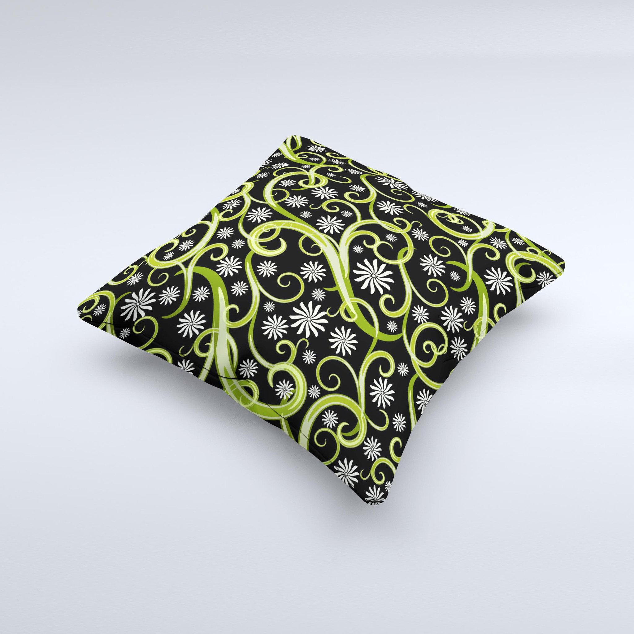 A decorative throw pillow featuring green floral swirls on a black background, showcasing a unique handcrafted design.