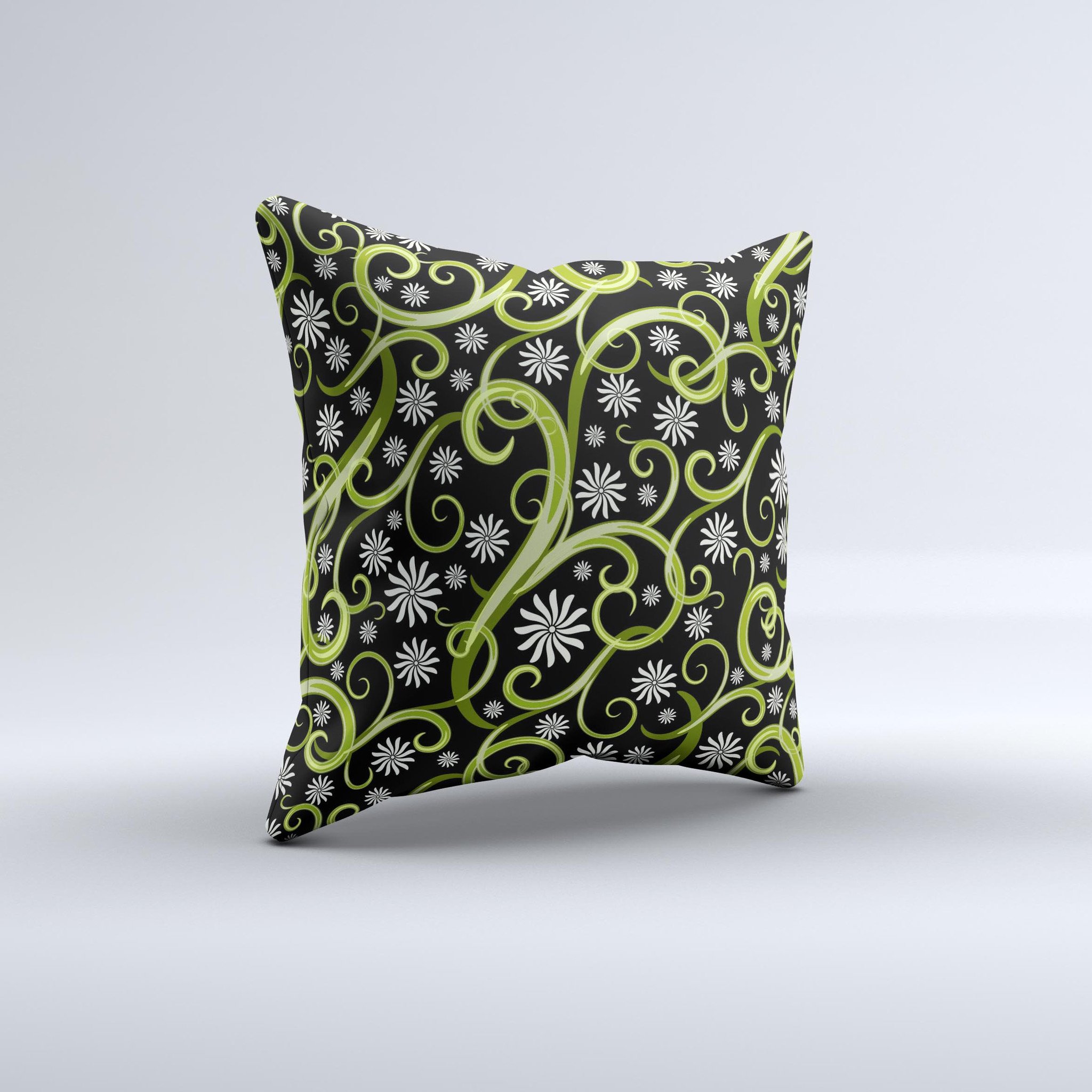 A decorative throw pillow featuring green floral swirls on a black background, showcasing a unique handcrafted design.