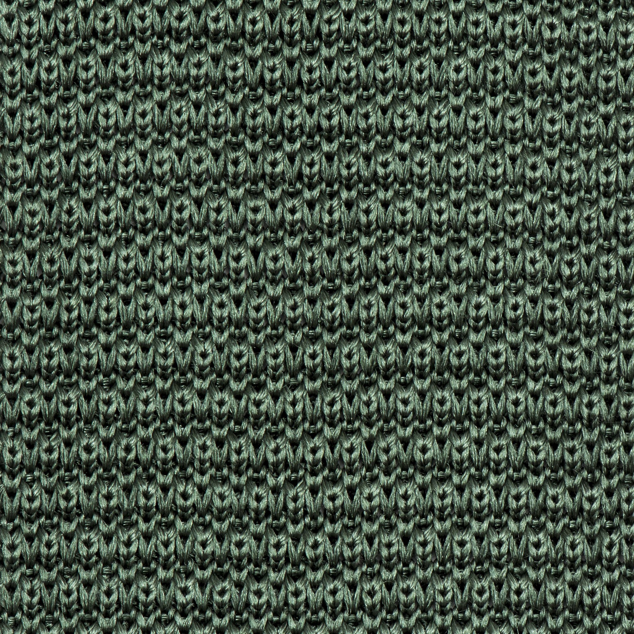 A stylish green knitted tie made of silk, featuring a pointed end and a 6cm width, perfect for formal occasions.