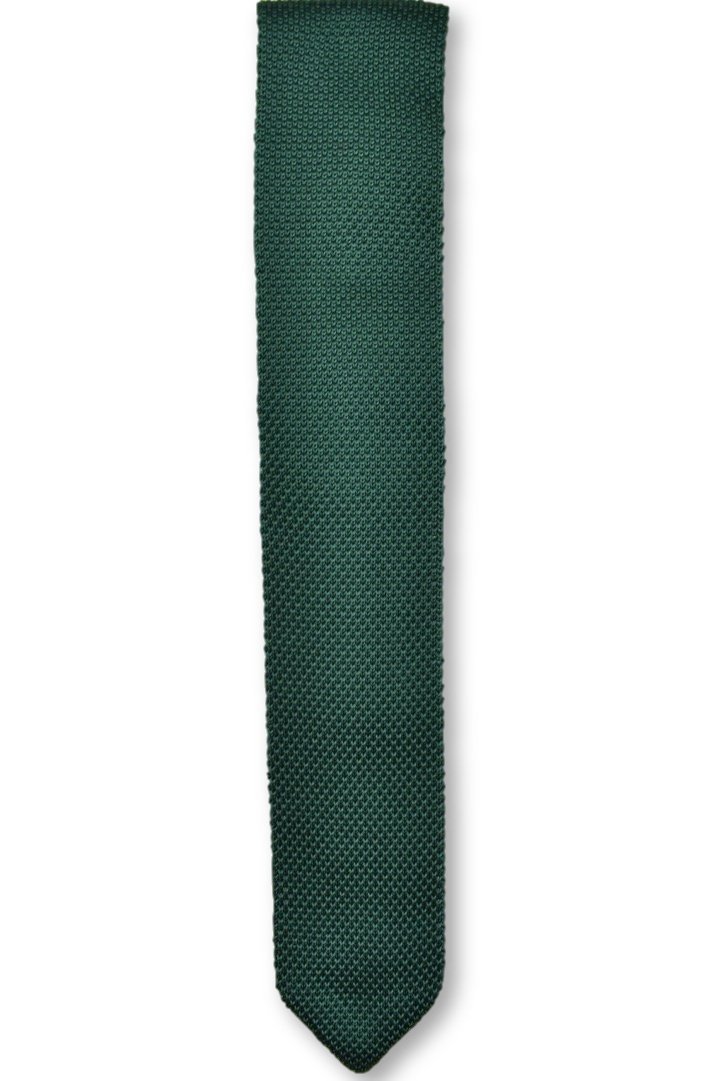 A stylish green knitted tie with a pointed end, showcasing its textured design and modern 6cm width.