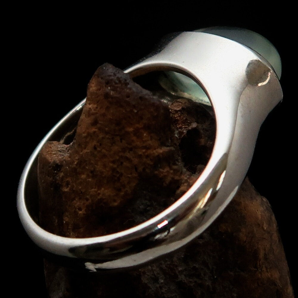 Handmade sterling silver solitaire ring featuring an oval green Prehnite stone, showcasing a polished finish and minimalist design.