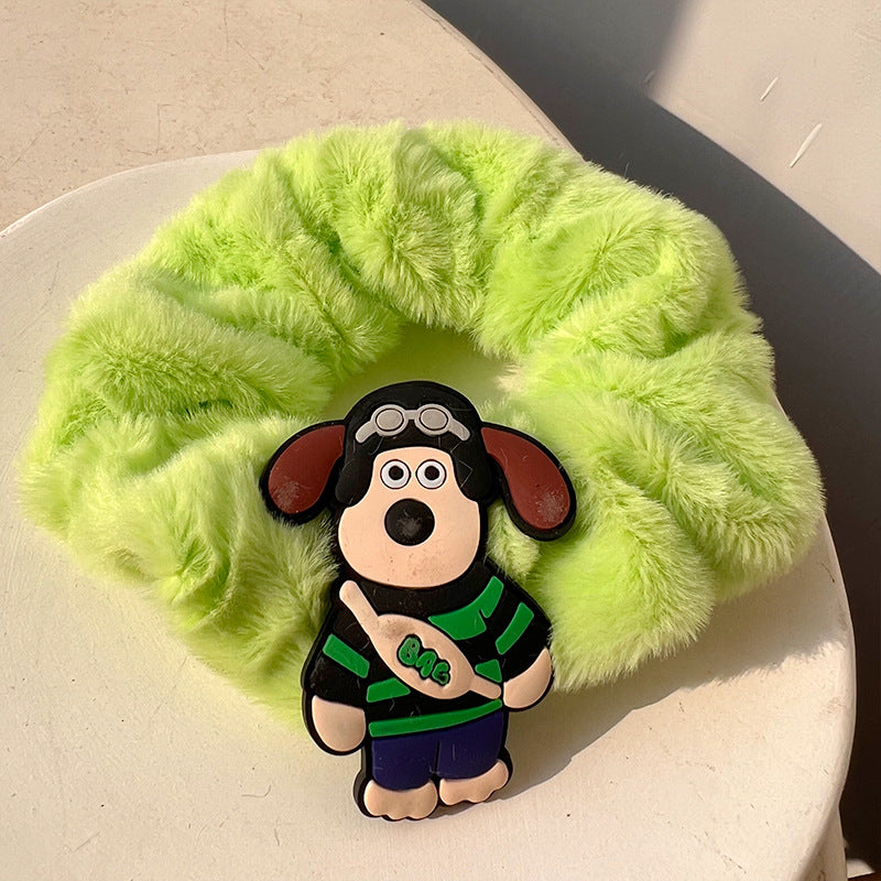 A vibrant green plush hair tie, soft and stylish, perfect for adding a playful touch to hairstyles.