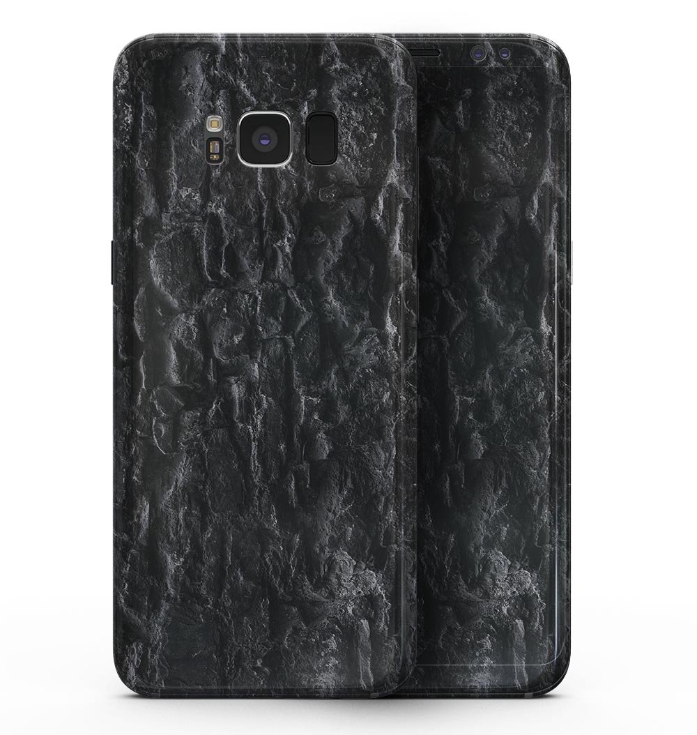 Samsung Galaxy S8 with Grungy Black Brick Wall skin, showcasing a stylish and protective design.