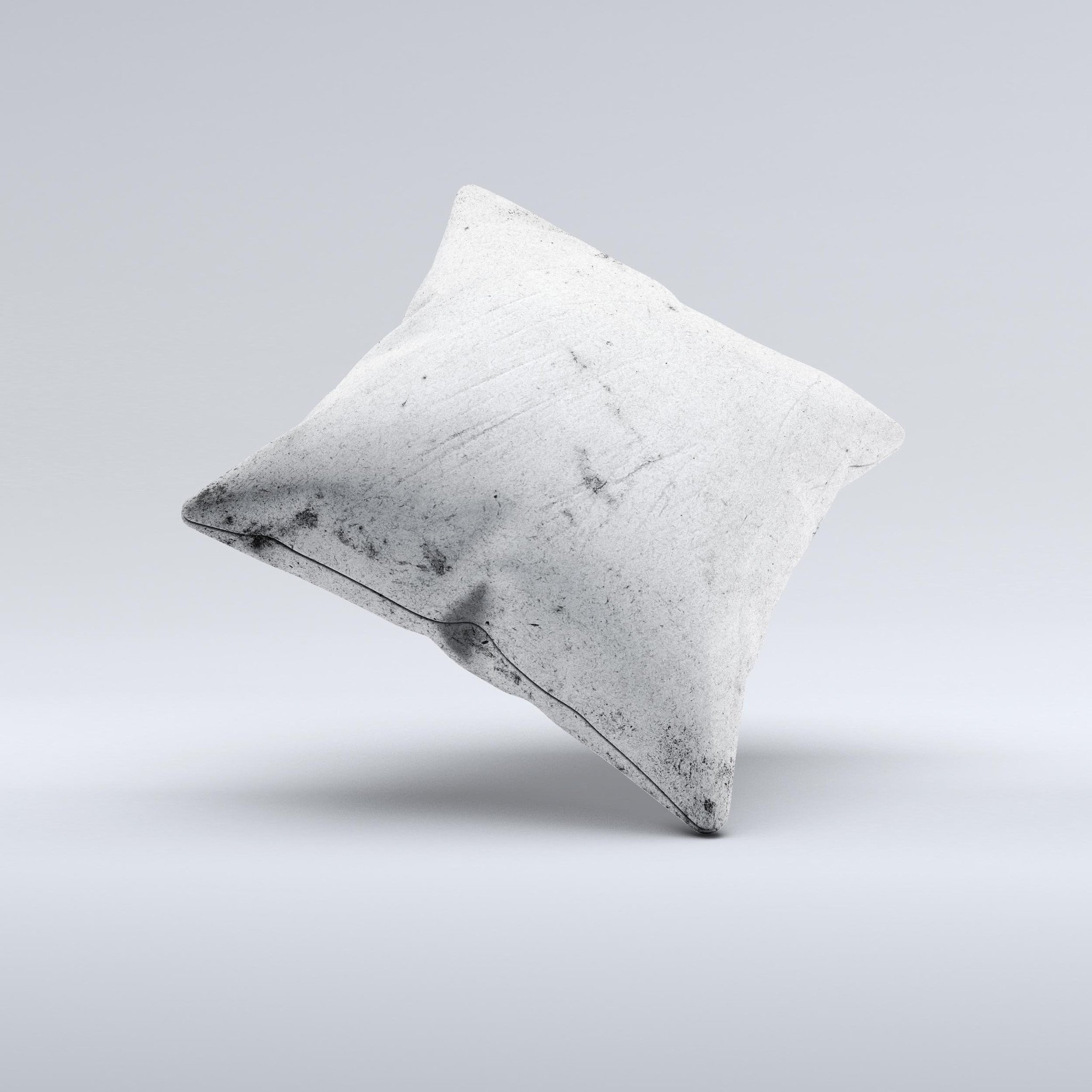 Grungy concrete textured decorative throw pillow with ink-fuzed design, showcasing unique handmade characteristics.