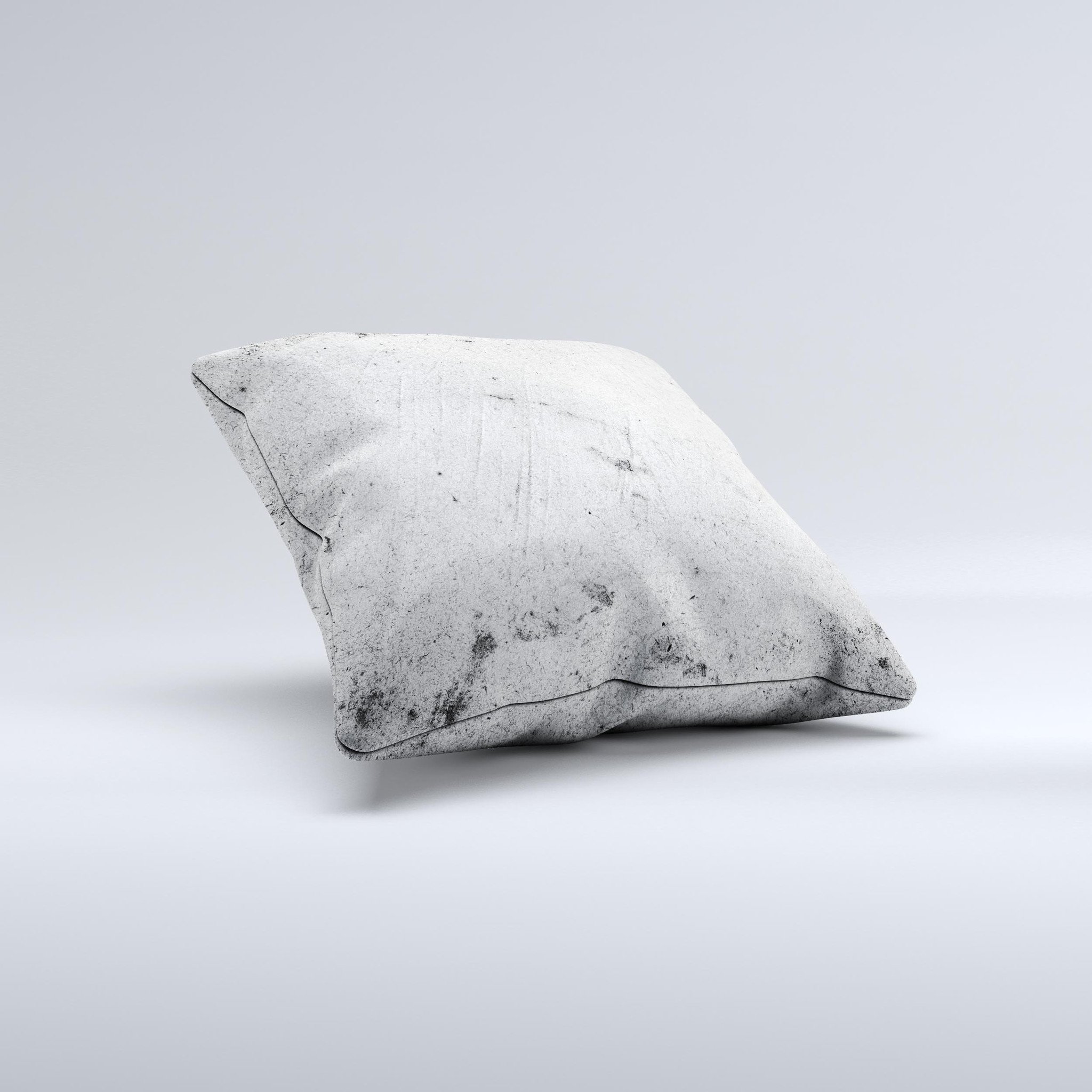 Grungy concrete textured decorative throw pillow with ink-fuzed design, showcasing unique handmade characteristics.