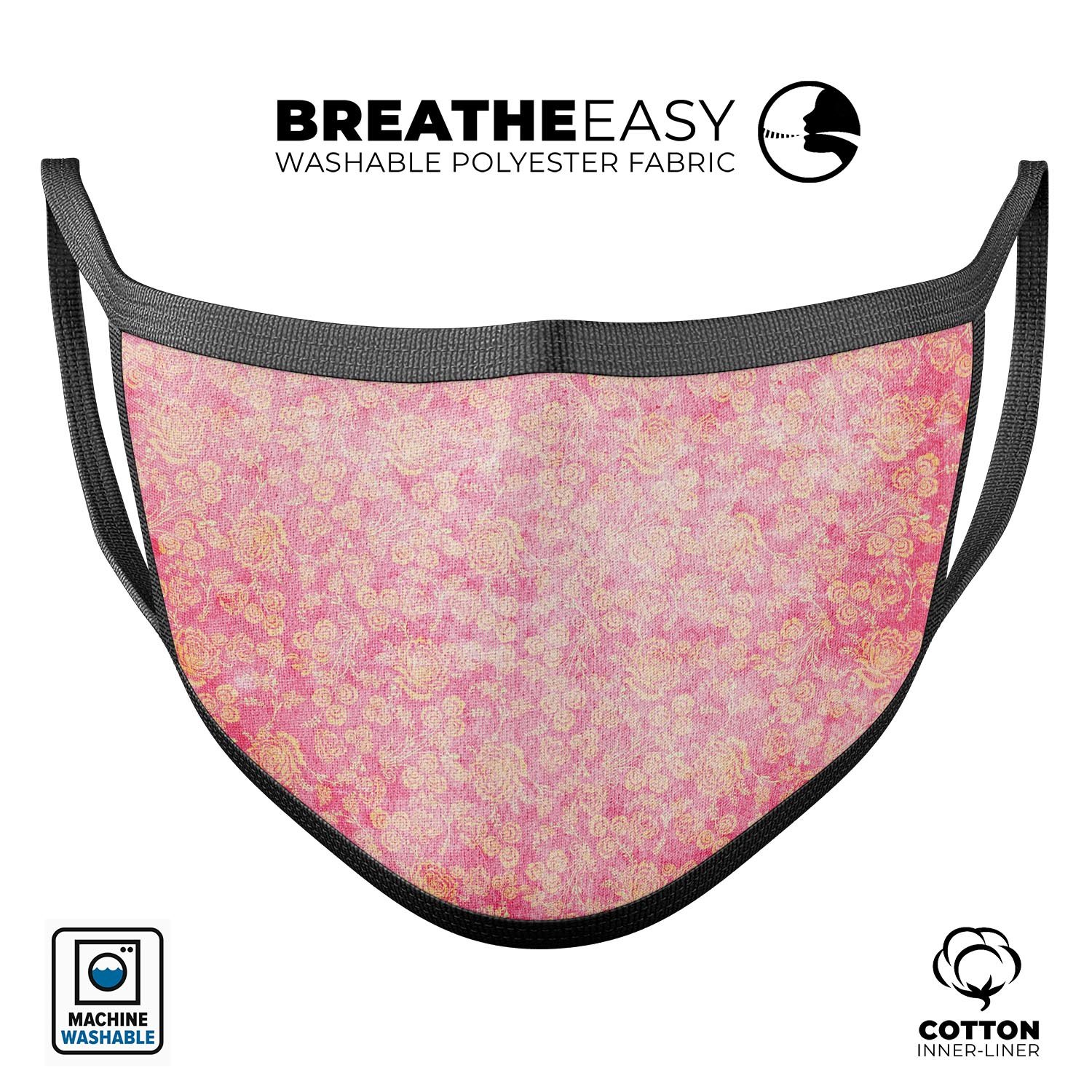 Grungy floral pattern mouth cover in scratched pink, showcasing adjustable ear loops and soft cotton interior.