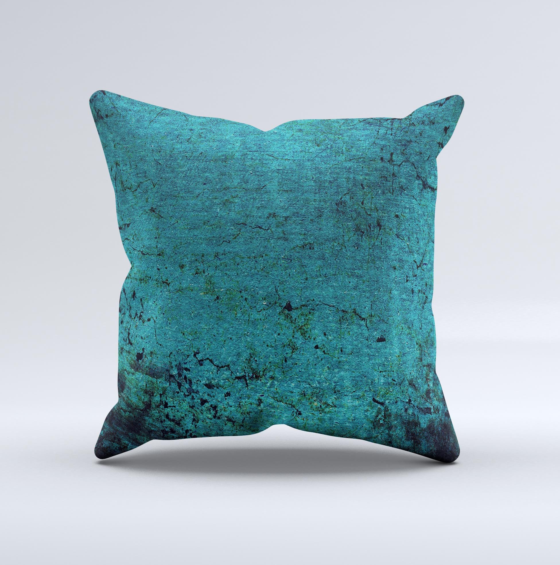 Grungy teal decorative throw pillow with unique ink-fuzed design, handcrafted in Virginia, showcasing high-quality fabric and filling.