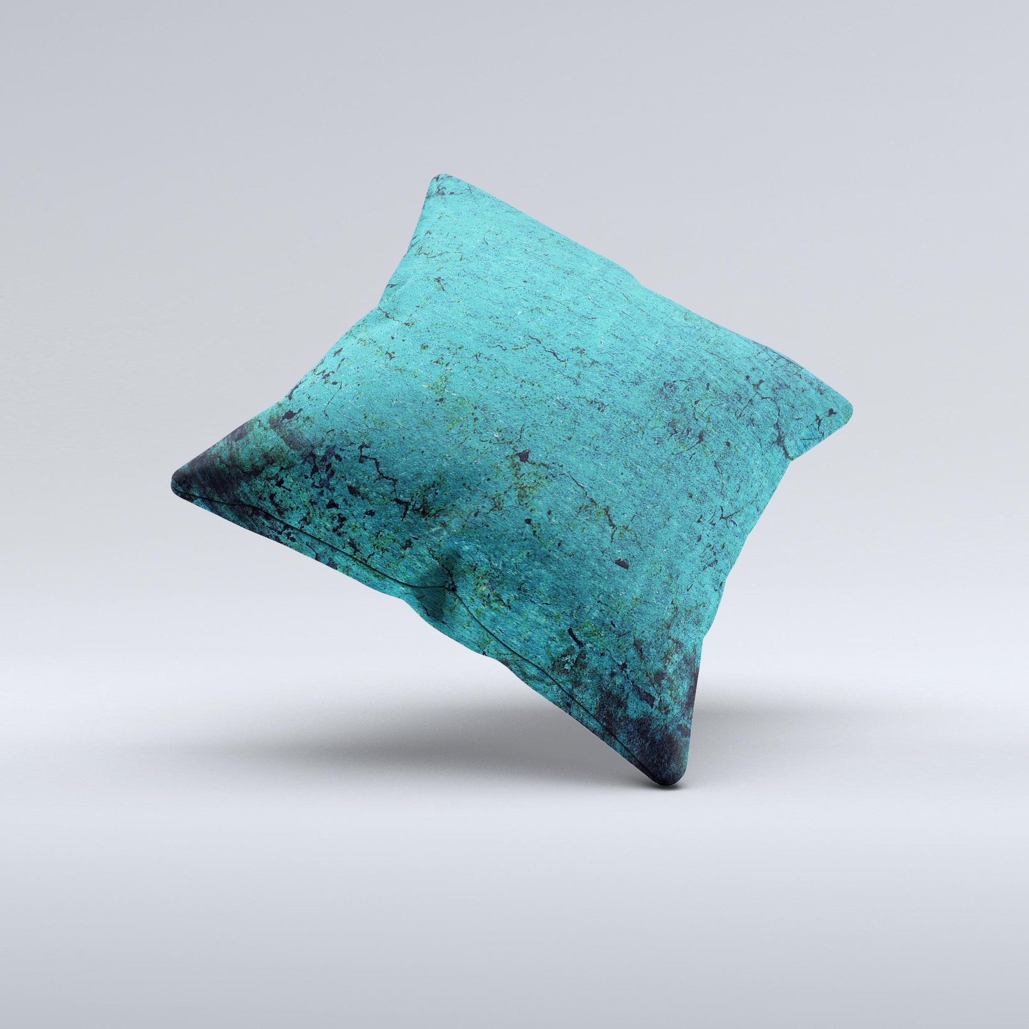 Grungy teal decorative throw pillow with unique ink-fuzed design, handcrafted in Virginia, showcasing high-quality fabric and filling.