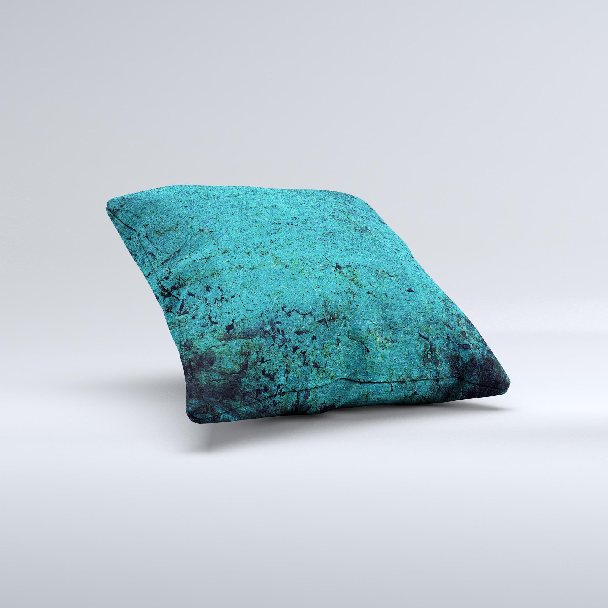 Grungy teal decorative throw pillow with unique ink-fuzed design, handcrafted in Virginia, showcasing high-quality fabric and filling.