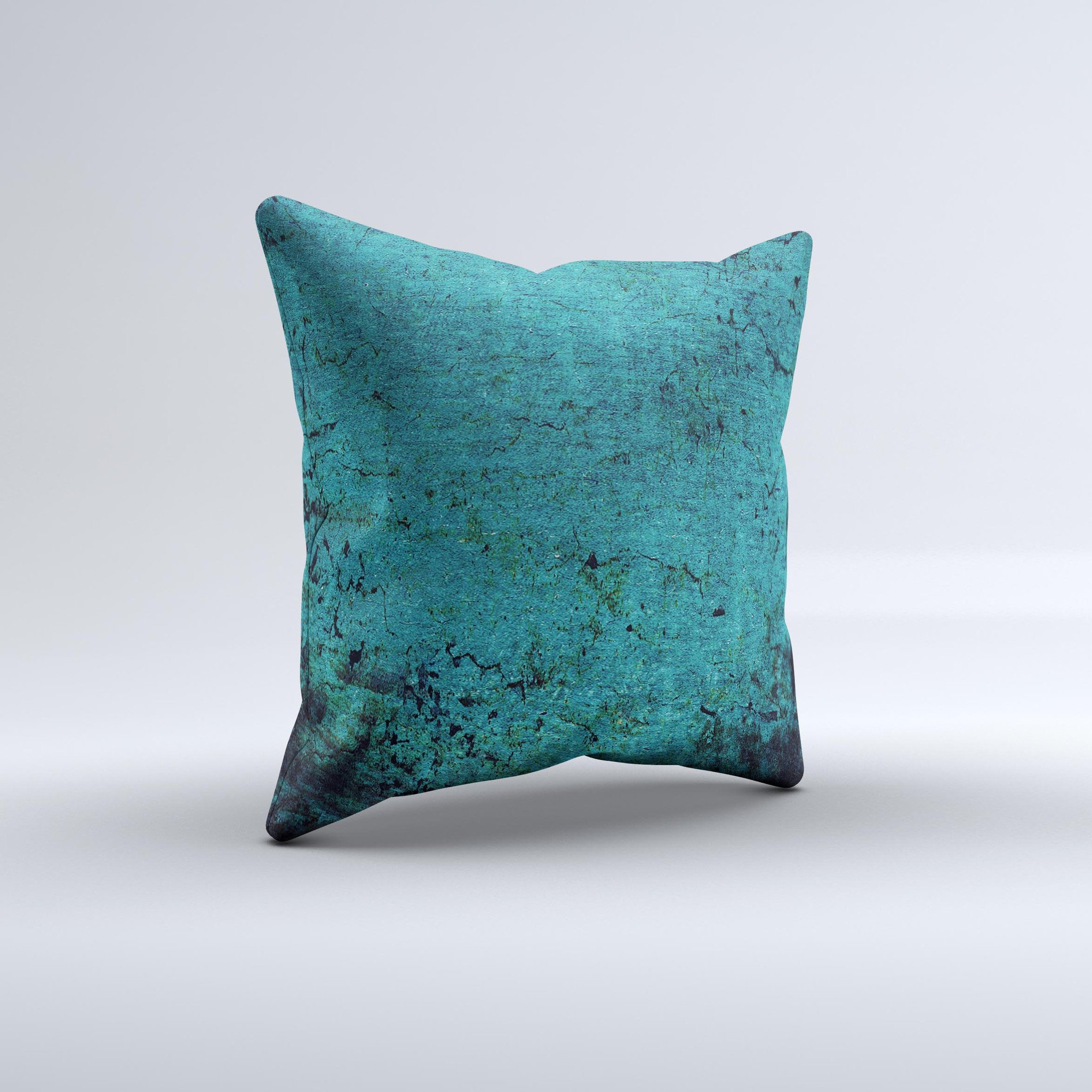 Grungy teal decorative throw pillow with unique ink-fuzed design, handcrafted in Virginia, showcasing high-quality fabric and filling.