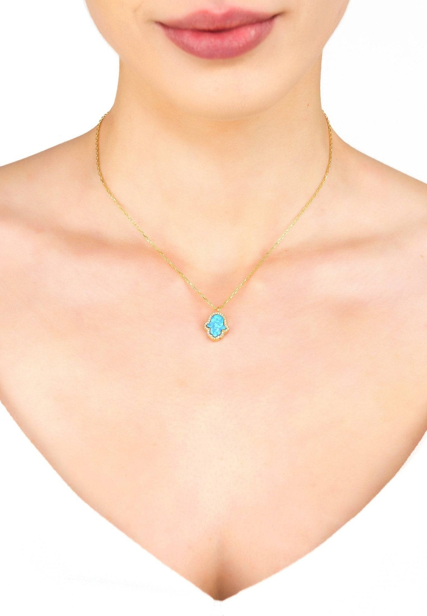 Hamsa Opalite Turquoise Blue Necklace Gold featuring an iridescent opalite gemstone and sparkling zirconia on a 925 sterling silver chain.