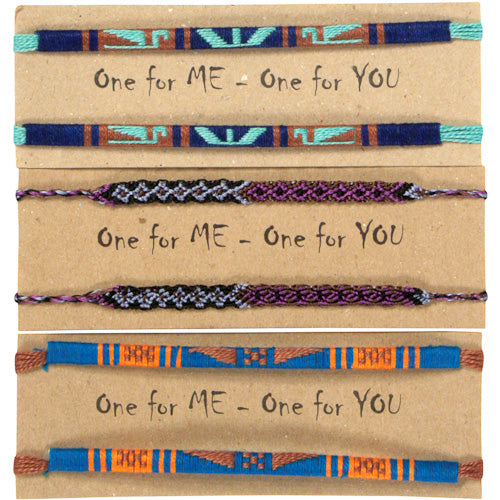 A pair of colorful hand-woven friendship bracelets showcasing intricate patterns and vibrant colors, symbolizing friendship and unity.