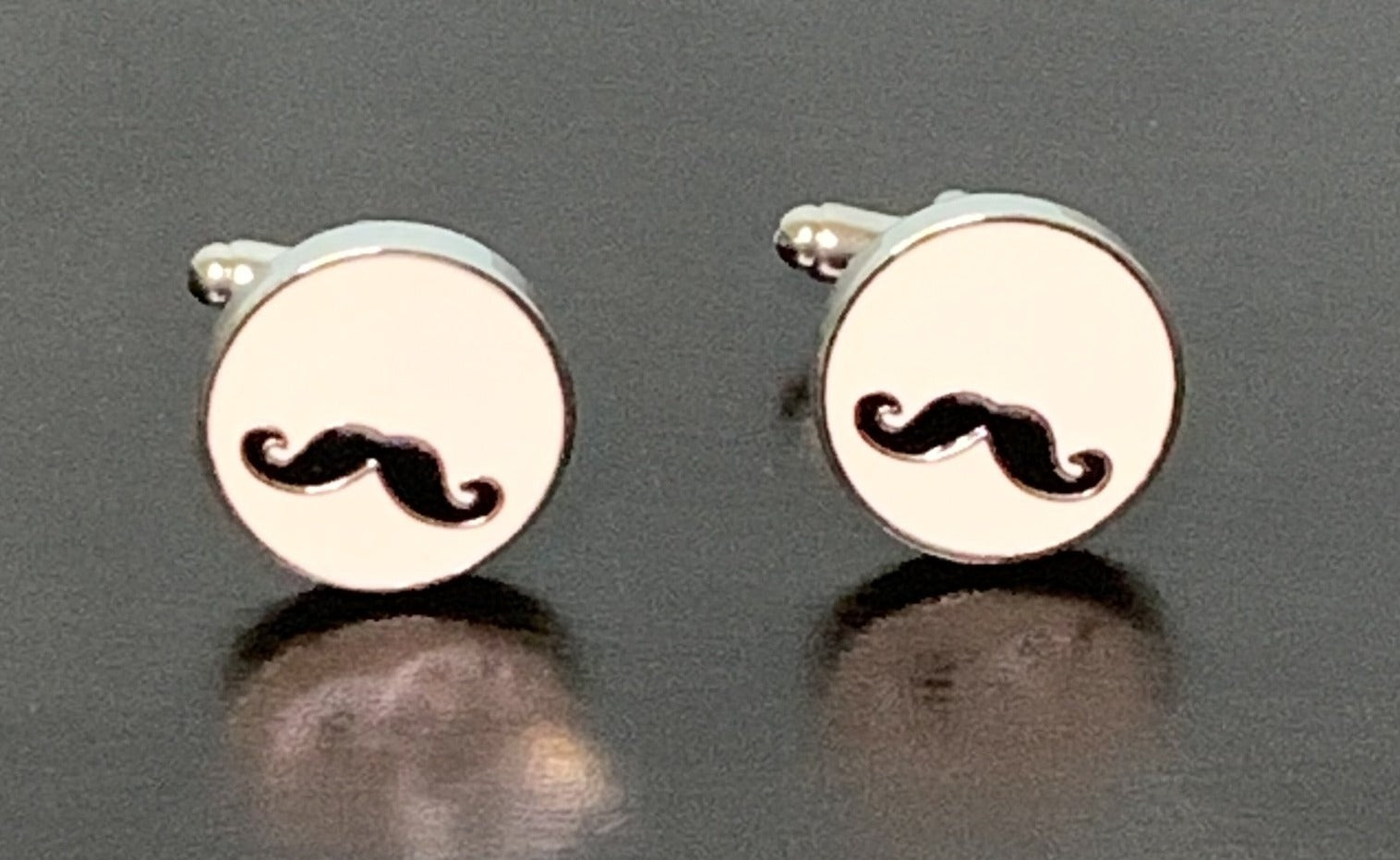 Elegant Handle Your Business Cufflinks featuring a black handlebar moustache design on white enamel, perfect for the modern gentleman.