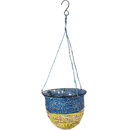 Colorful hanging basket made from recycled candy wrappers, showcasing intricate craftsmanship and eco-friendly design.