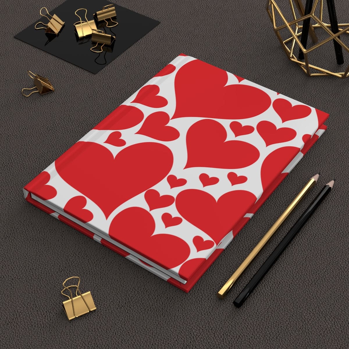 A stylish hardcover journal featuring a vibrant love red hearts design, perfect for personal journaling with lined pages.