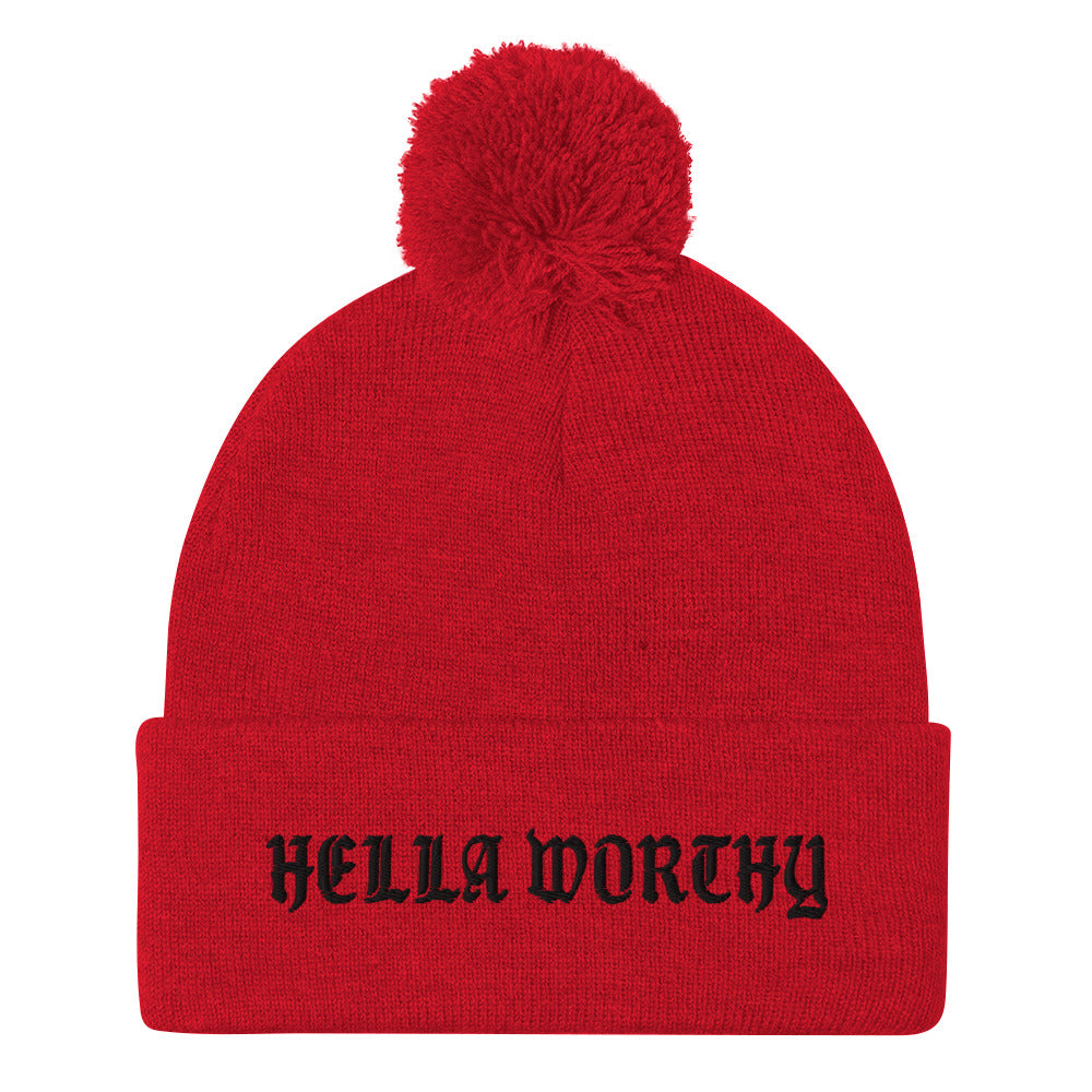 Hella Worthy Pom-Pom Beanie in a classic embroidered design with a playful pom-pom on top, showcasing its warm and stylish features.