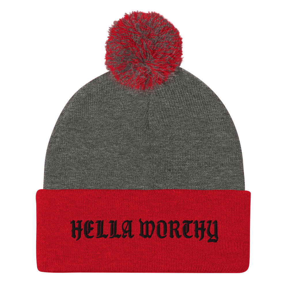 Hella Worthy Pom-Pom Beanie in a classic embroidered design with a playful pom-pom on top, showcasing its warm and stylish features.