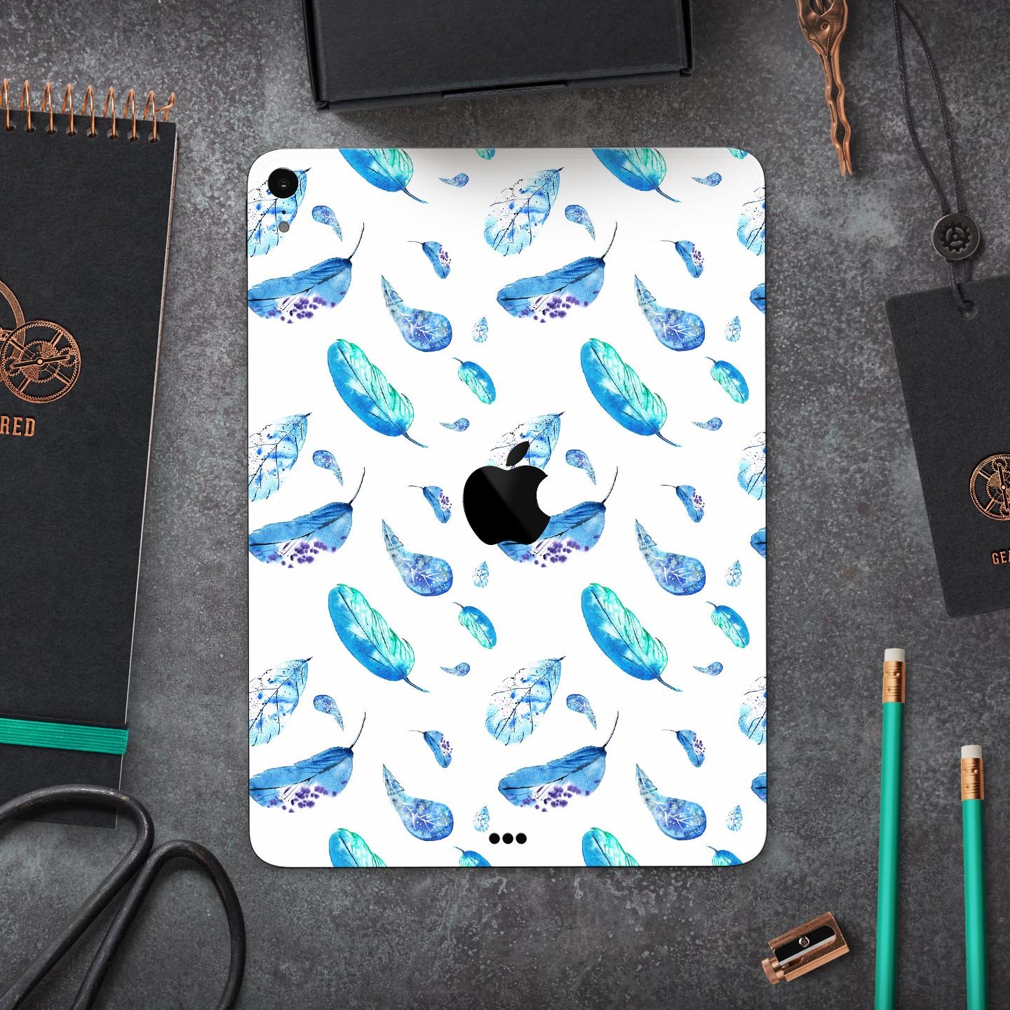 Hipster Feather Pattern Full Body Skin Decal for Apple iPad Pro, showcasing vibrant feather design on a sleek surface.