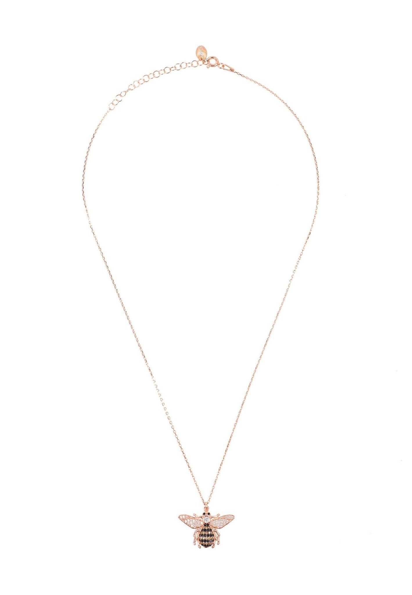 A beautiful rose gold honey bee pendant necklace featuring sparkling white, champagne, and black zircons, elegantly displayed on a white background.