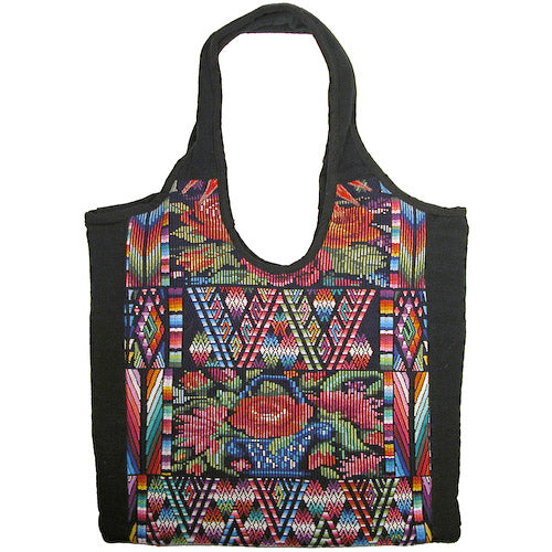 Colorful Huipil Handbag showcasing traditional Mayan textile patterns, artisan-crafted in Guatemala.