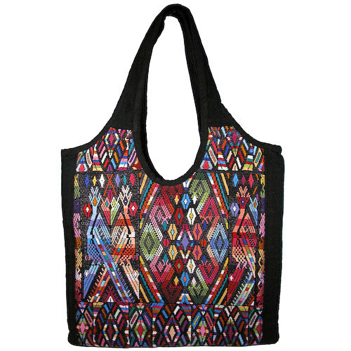 Colorful Huipil Handbag showcasing traditional Mayan textile patterns, artisan-crafted in Guatemala.