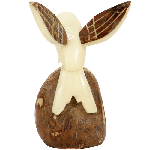 Handcrafted Humming Bird figurine with brown wings made from tagua nut, showcasing intricate details and natural beauty.