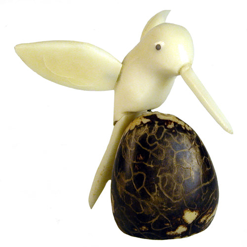 Handcrafted Humming Bird figurine made from tagua nut, showcasing natural wings and intricate details, symbolizing eco-friendly artistry.