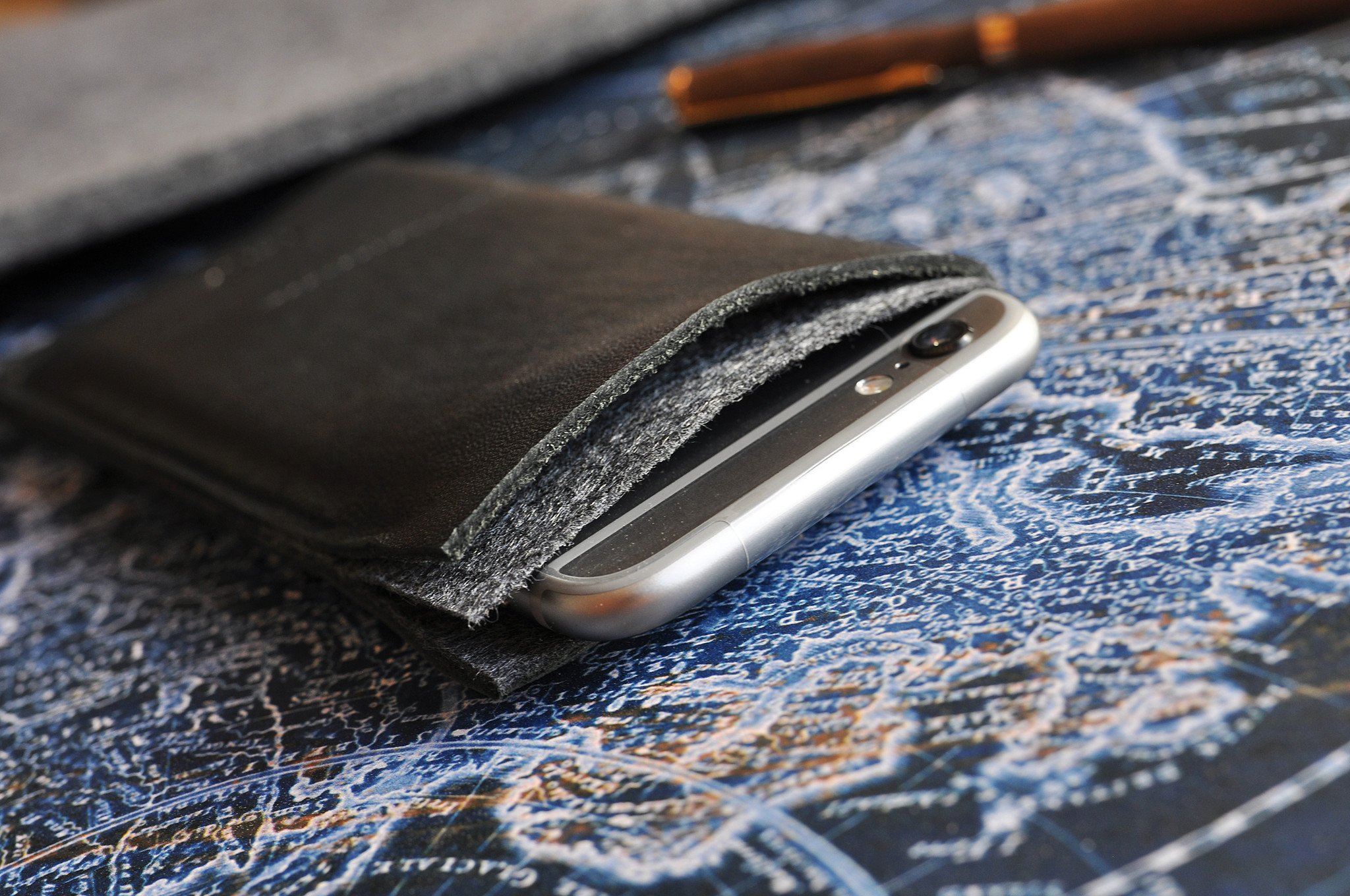 Stylish iPhone Wrap made from American Horween Leather and wool felt, featuring heat burnished details and slots for cash and cards.