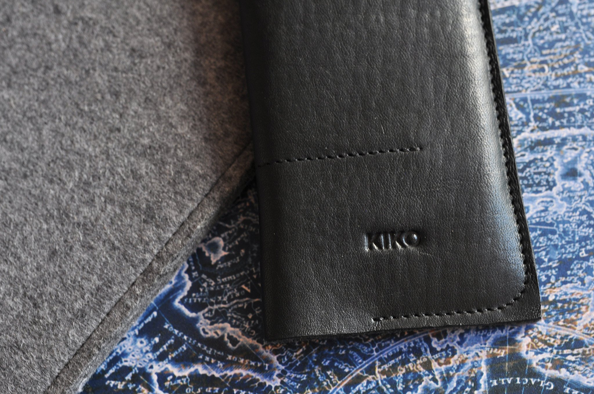 Stylish iPhone Wrap made from American Horween Leather and wool felt, featuring heat burnished details and slots for cash and cards.