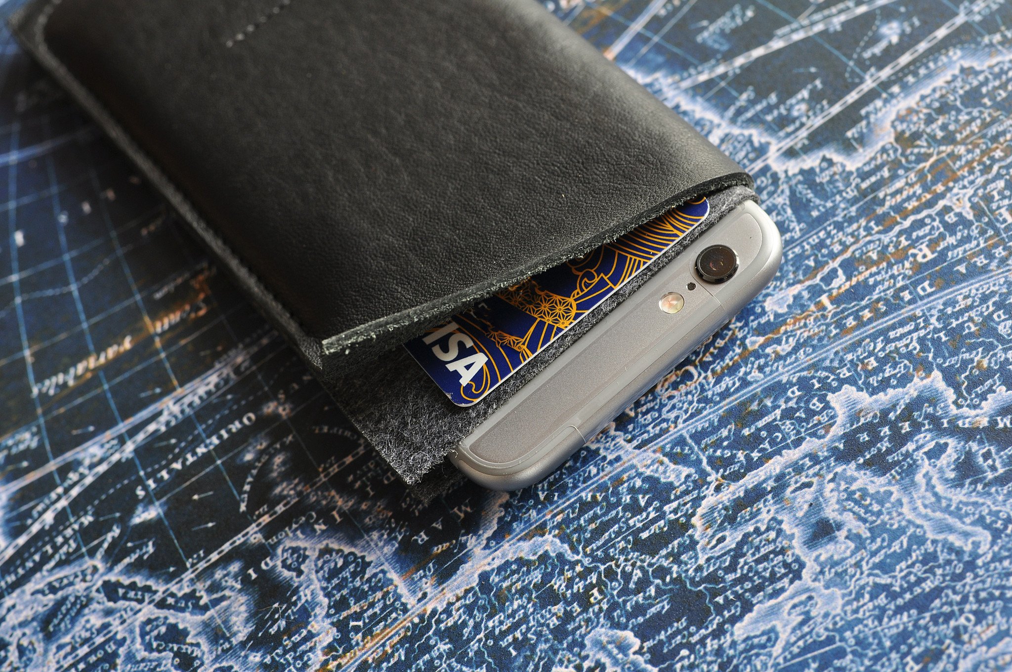 Stylish iPhone Wrap made from American Horween Leather and wool felt, featuring heat burnished details and slots for cash and cards.