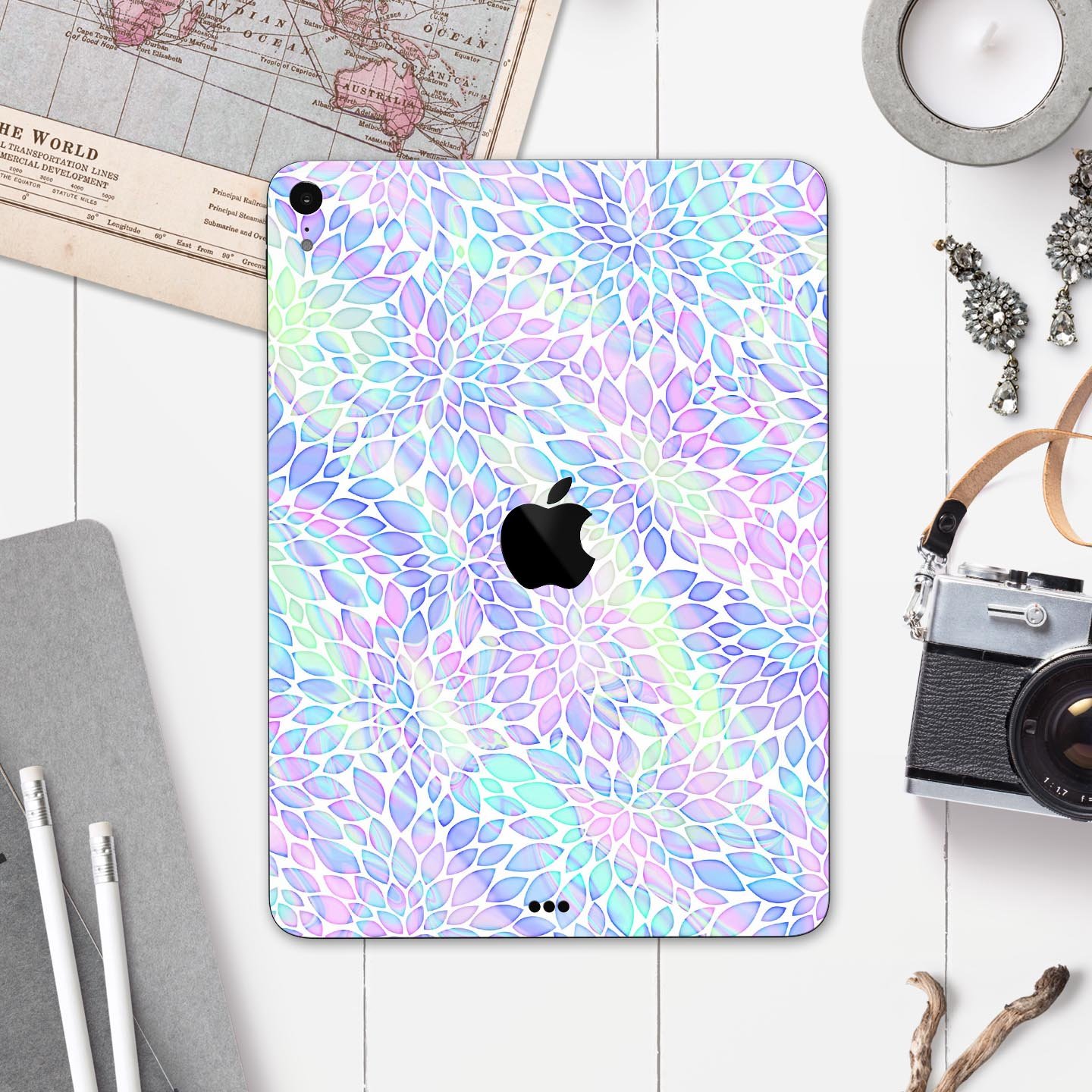 Iridescent Dahlia v3 skin decal applied on an Apple iPad Pro, showcasing vibrant colors and sleek design.