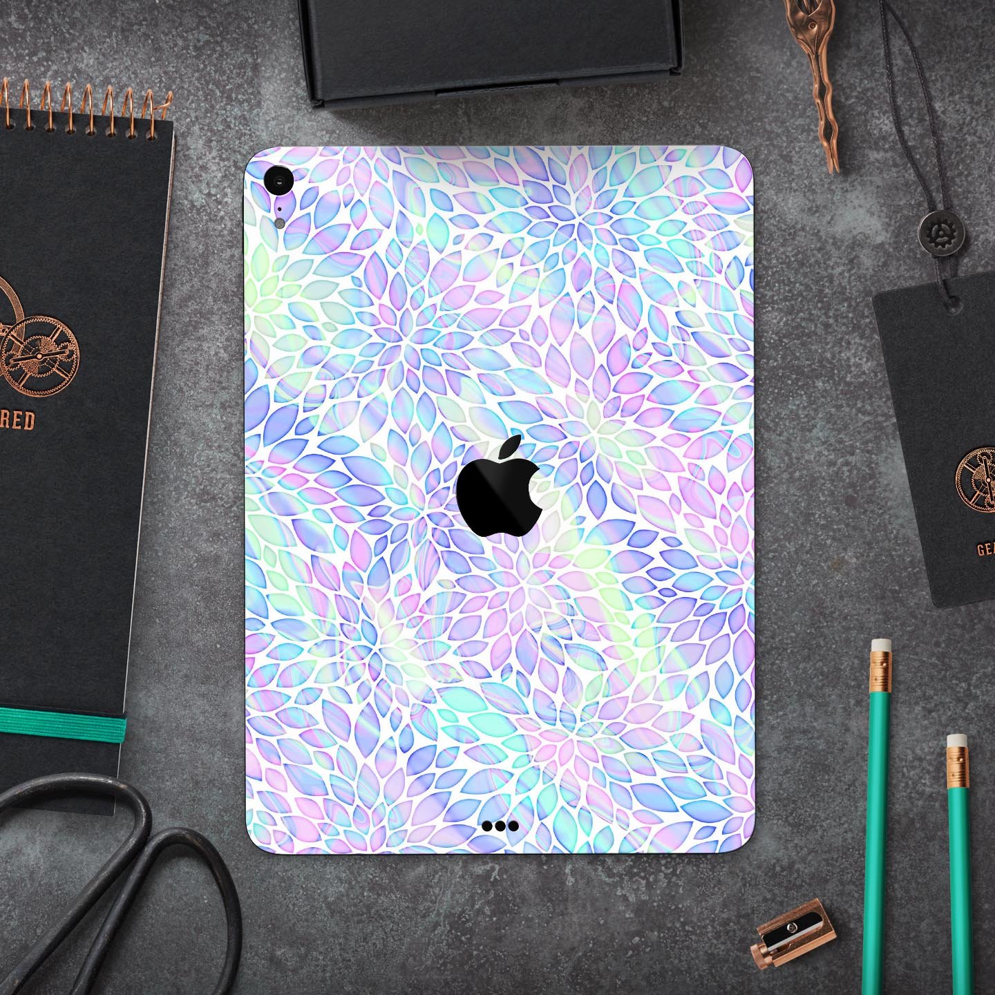 Iridescent Dahlia v3 skin decal applied on an Apple iPad Pro, showcasing vibrant colors and sleek design.