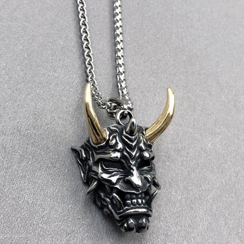 Japanese Ghost Skull Mask Necklace in gold and silver, featuring intricate skull design and alloy material.