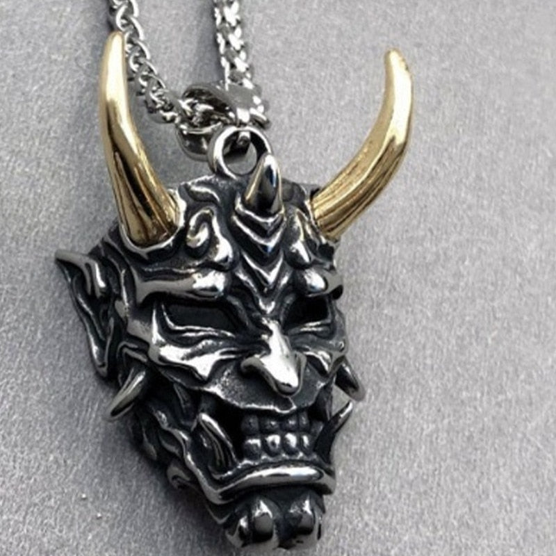 Japanese Ghost Skull Mask Necklace in gold and silver, featuring intricate skull design and alloy material.