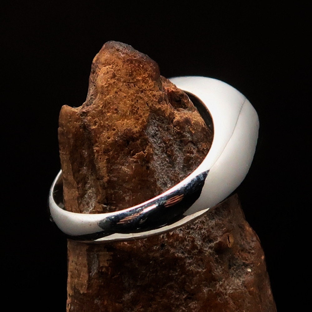 Sterling silver pinky ring featuring a black Hebrew word design spelling 'Jesus' on an oval face, showcasing its elegant finish.