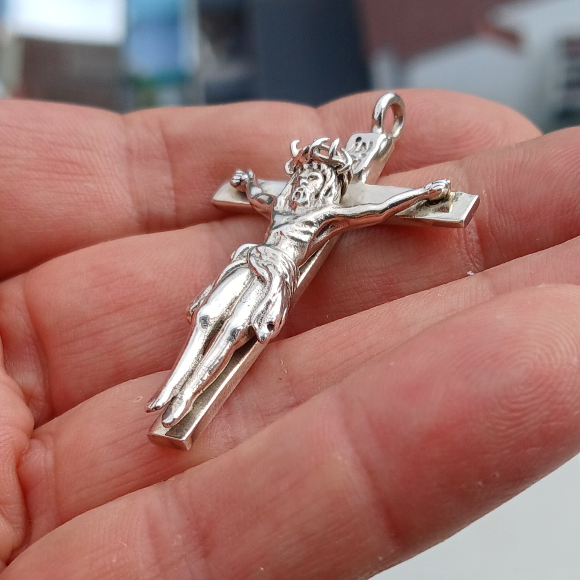 Sterling silver Jesus on the Cross pendant amulet, intricately designed with detailed craftsmanship.