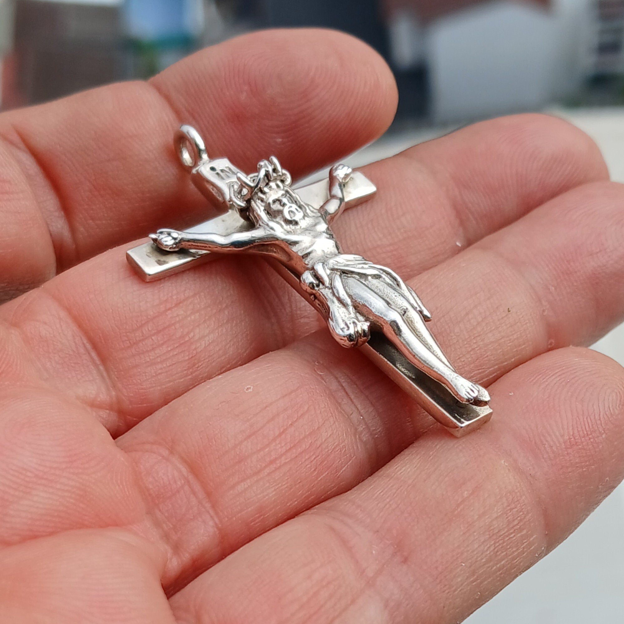 Sterling silver Jesus on the Cross pendant amulet, intricately designed with detailed craftsmanship.