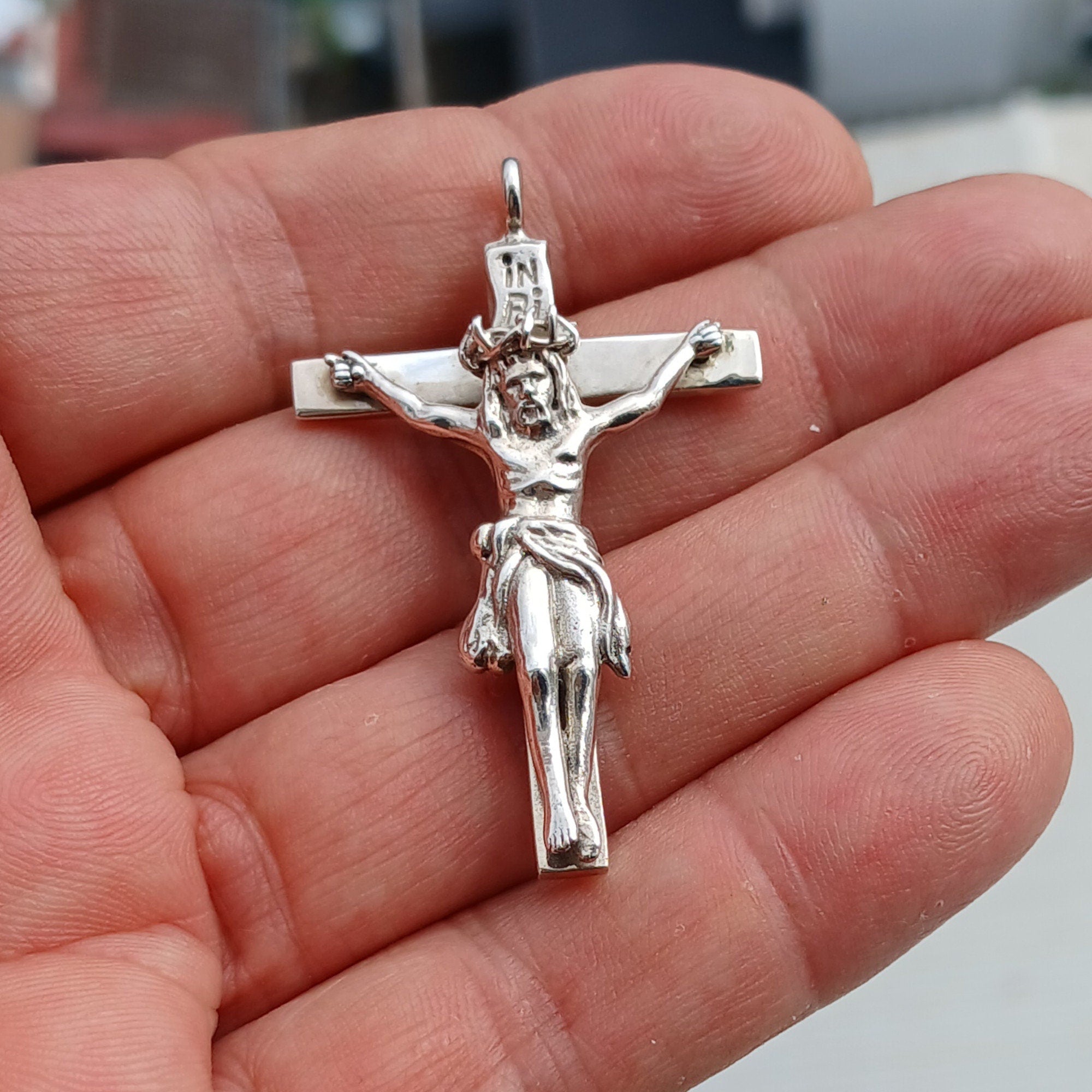 Sterling silver Jesus on the Cross pendant amulet, intricately designed with detailed craftsmanship.