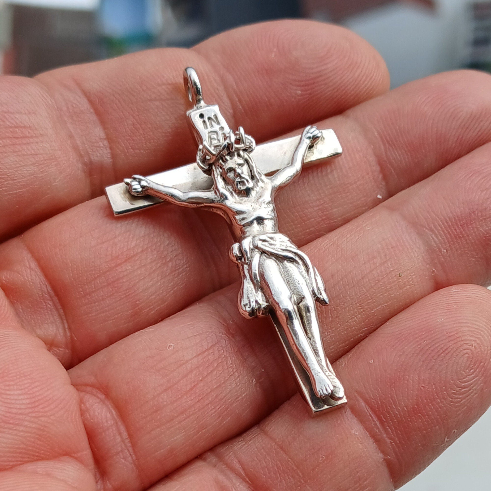 Sterling silver Jesus on the Cross pendant amulet, intricately designed with detailed craftsmanship.