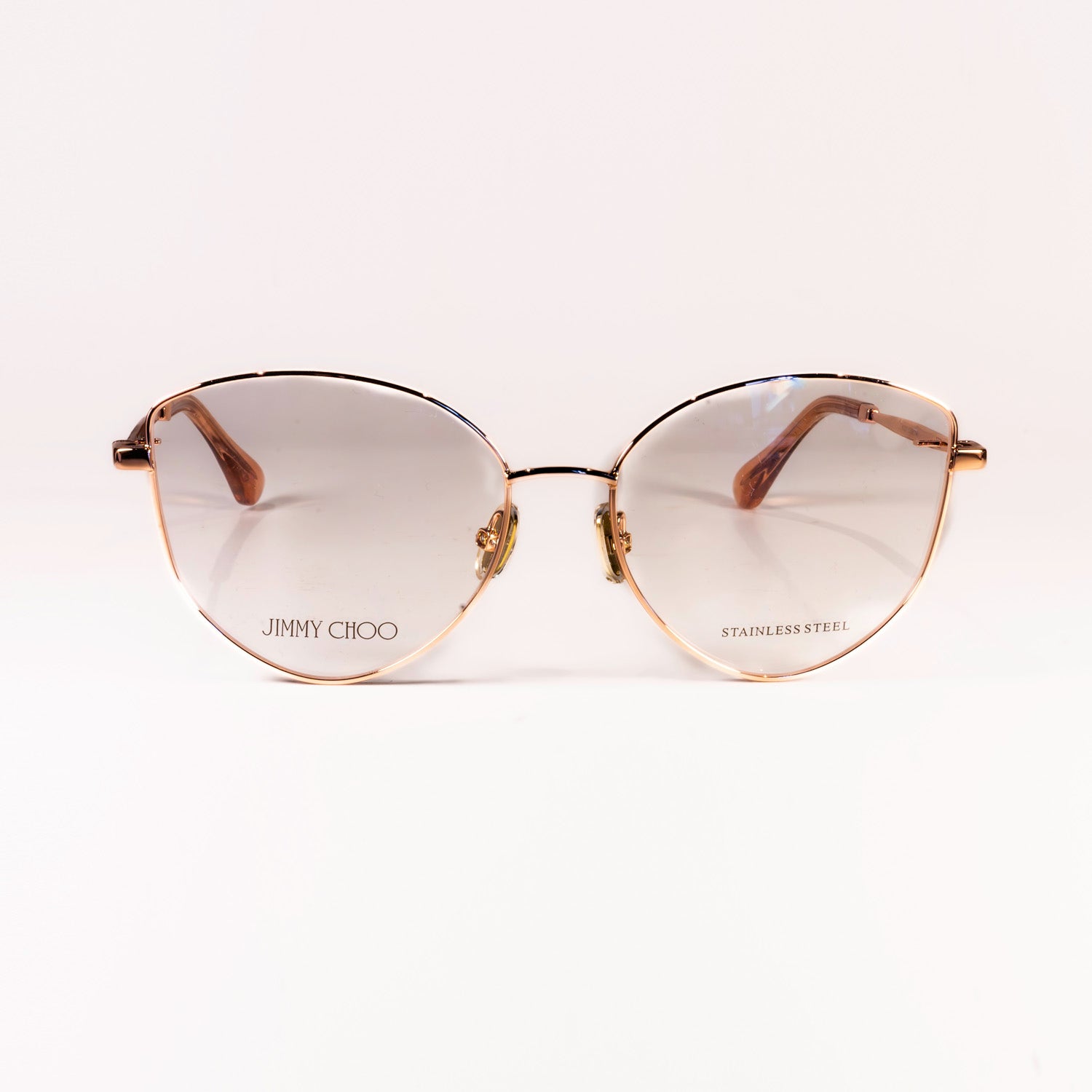 Jimmy Choo JC327 sunglasses featuring a cat-eye design in rose gold and gold, crafted from metal for a luxurious look.