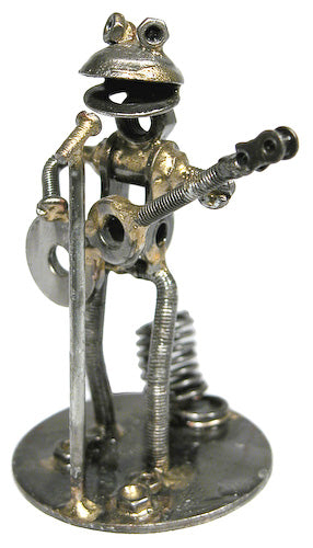 A whimsical frog guitarist pen holder made from recycled metal, showcasing creativity and craftsmanship.