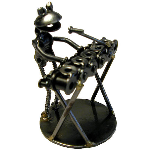 A whimsical Junkyard Frog Keyboard Player sculpture made from recycled metal, showcasing a frog playing a keyboard with vibrant colors.