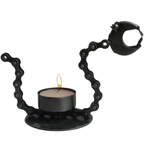 A unique tealight holder shaped like a snake, crafted from upcycled bicycle chains, showcasing intricate details and a rustic finish.