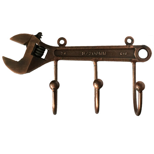 A unique Junkyard Wrench Key Holder made from upcycled materials, showcasing its industrial design and functionality.