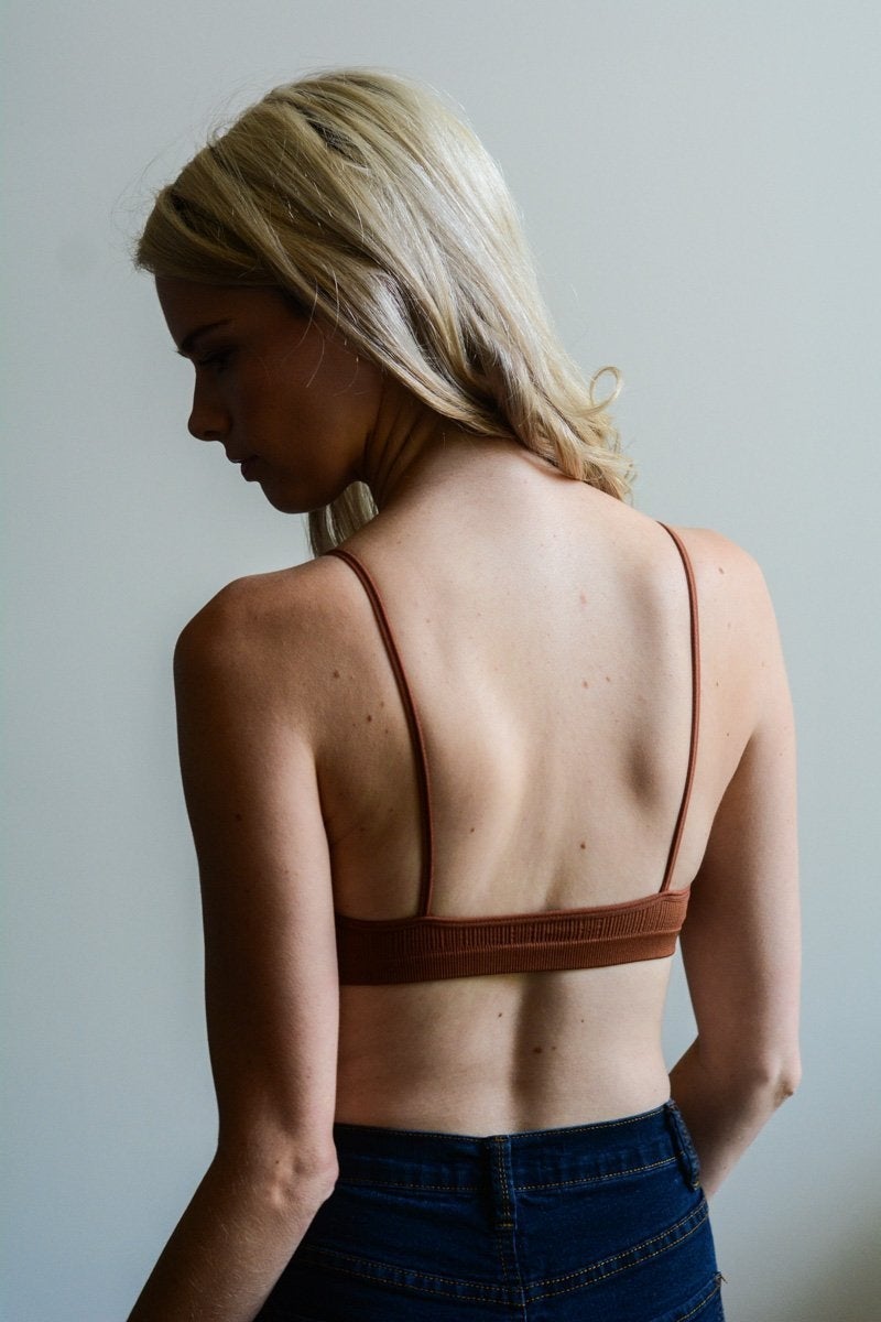 Kali Cross Plunge Bralette in seamless design, perfect for low-cut tops.